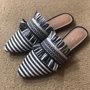 Black and white mule flats. Size 6.5